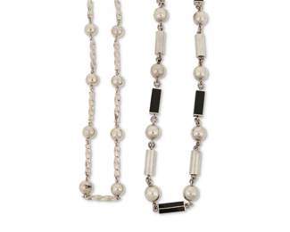 2232
Two Silver Sautoir Necklaces
Mid-20th century
One stamped to clasp: Mexico / 925 / TC-60
Comprising a Mexican sterling silver necklace with silver ball and twisted rectangular beads (25" L) and a Mexican-style silver-toned metal and inset onyx bead necklace with alternating silver ball and cylinder beads (34" L), 2 pieces
274.0 grams gross
Estimate: $300 - $500