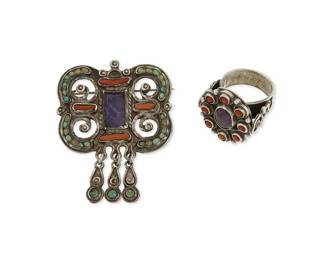 2087
A Group Of Matl Mexican Silver Jewelry
Matilde Poulat (c. 1900-d. 1960)
Circa 1934-1950; Mexico City, Mexico
Each marked in etched script: Matl / Mexico / 925; brooch further marked: [Eagle 129]
Two works designed by Matilde Poulat for Matl comprising a sterling silver brooch with filigree overlay, openwork scrolls set with coral, turquoise, and amethyst, and with three dangles (2" H x 1.5" W) as well as a sterling silver oval ring with cluster set coral and central amethyst cabochon (ring size: 5.5), 2 pieces
20.7 grams gross
Estimate: $400 - $600