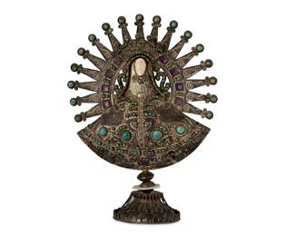 2033
A Sterling Silver Matl Nuestra Senora De La Asuncion De Tonaya
Matilde Poulat and Ricardo Salas (d. 1960 and d. 2006)
Circa 1960-2006; Mexico City, Mexico
Stamped verso: Matl / Mexico / 925 / Salas / YOD-PAT / 0502 / [Eagle 129]; further inscribed in script: Matl
Designed by Matilde Poulat for Matl, under the directorship of Ricardo Salas, in sterling silver set with amethyst, turquoise, and coral and raised on a cloche base
8.25" H x 5.625" W x 2.75" D
275.3 grams gross
Estimate: $1,000 - $2,000