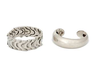 2178
Two Antonio Pineda Mexican Silver Bracelets
Antonio Pineda (1919-2009)
Circa 1953-1979; Taxco, Mexico
Each with crown mark for Antonio Pineda; Eagle 17; each variously stamped: Hecho en Mexico / 970 / [Design number]
Comprising a sterling silver stylized curved link bracelet (No. ZZ616; 7" L x 0.75" H) and a sterling silver domed cuff bracelet (No. ZZ803; 6.25" total inner C x 0.875" H, with a 0.875" gap), 2 pieces
175.6 grams
Estimate: $500 - $700