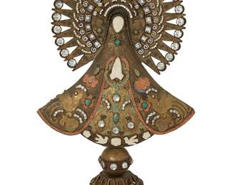 2034
A Large Matl Nuestra Senora De La Asuncion De Tonaya
Matilde Poulat (c. 1900-d. 1960)
Mid-20th century; Mexico City, Mexico
Etched script signature verso: Matl / Mexico
A large elaborate brass and copper santos figure on a cloche base, with set coral, turquoise and clear cut stone accents
21" H x 12.5" W x 7" D
Estimate: $6,000 - $9,000