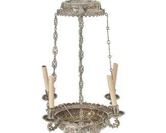 2052
19th century
A Spanish Colonial Silver Chandelier
Appears unmarked
The four-light chandelier/censer converted to electricity with faux candles, featuring all-over cast and repoussé foliate motifs, electrified
41" H x 22" Dia.
179 gross oz. troy approximately
Estimate: $4,000 - $6,000