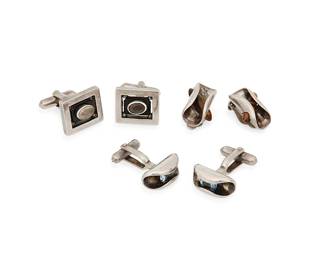 2227
A Group Of Antonio Pineda Mexican Silver And Gemstone Jewelry
Antonio Pineda (1919-2009)
Circa 1953-1979; Taxco, Mexico
Each with crown mark for Antonio Pineda; further variously stamped: Hecho en Mexico / 970 / [Eagle 17] / [indistinct eagle]
Three works in sterling silver comprising a pair of faceted blue stone curved cufflinks (each: 0.875" H), a pair of contra luz opal and onyx cufflinks (each: 0.75" H), and a pair of tiger's eye earclips (0.875" H), 6 pieces
56.7 grams gross
Estimate: $500 - $700