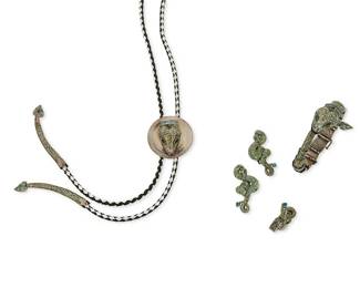 2192
A Group Of Margot De Taxco "Serpent" Sterling Silver And Enamel Jewelry
Margot Van Voorhies (1896-1985)
Circa 1955-1978; Taxco, Mexico
Each stamped: Margot de Taxco / Sterling / Made in Mexico / Eagle 16 / 5554
Designed by Margot Van Voorhies, comprising a sterling silver and green enamel snake head bolo tie with snake motif tips (1.625" Dia., tie: 35" L), an articulated snake bracelet (6.25" inner C x 1.5" H), a pair of green enamel coiled snake motif earclips (each: 1.75" H x 1" W), and a flexible sterling silver and enamel link ring (ring size: 7.5), 5 pieces
116.0 grams
Estimate: $1,000 - $1,500