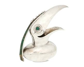 2081
Circa 1939-1962; Taxco, Mexico
A Los Castillo Silver-Plated Toucan Pitcher
Stamped: Los Castillo Taxco / Plateado / Hecho En Mexico / TA-01 / 315
The toucan form pitcher featuring inlaid greenstone accents to eyes and handle
12" H x 11.25" W x 4.5" D
Estimate: $500 - $700