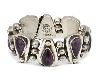 2154
An Antonio Pineda Silver And Amethyst Bracelet
Antonio Pineda (1919-2009)
Circa 1948-1953; Taxco, Mexico
Stamped: Silver by Tono / Taxco
A silver bracelet with teardrop and silver ball links set with amethysts
8" L x 1.25" H
97.6 grams gross
Estimate: $500 - $700