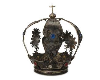 2056
Late 18th/early 19th century
A Continental Flat Strap Silver And Set Stone Crown
Appears unmarked
Comprising a four-strap sterling silver crown set with red, blue, and clear glass with alternating panels and floral spring ornaments
12" H x 10.5" Dia. approximately
45.9 gross oz. troy approximately
Estimate: $1,000 - $1,500