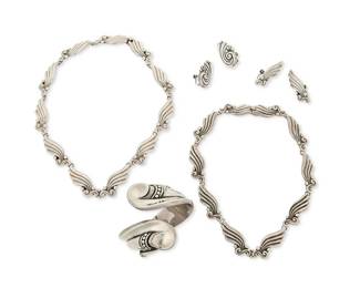 2193
A Group Of Margot De Taxco Silver Jewelry
Margot Van Voorhies (1896-1985)
Circa 1948-1978; Taxco, Mexico
Each stamped: Margot de Taxco / Sterling / Made in Mexico / [Eagle 16] / [Design number]
Five works designed by Margot Van Voorhies comprising a sterling silver hinged crossover cuff bracelet (No. 5410; 6.5" inner C x 1.25" H), two matching sterling silver foliate link necklaces (No. 5120; 14.5" L and 15.5" L), with one pair of matching screw back earrings (each: 1.5" H), and a pair of similar style silver earrings (No. 5291; each: 1.25" H), 7 pieces
203.1 grams
Estimate: $1,000 - $1,500