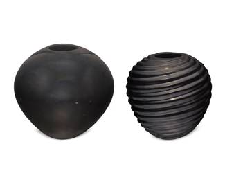 2156
Two Mexican Mata Ortiz Pottery Vessels
Two works:

Hector Ortega (b. 20th century)
A blackware "melon" jar, late 20th/early 21st century
Signed to underside: Hector Ortega
The jar with burnished black slip glaze with a tapering spiral form
10.125" H x 10.25" Dia.

Reuben Lucero (b. 20th century)
A blackware pot, late 20th/early 21st century
Signed to underside: R Lucero
The globular pot with a polished finish
11.5" H x 12.125" Dia.

2 pieces
Estimate: $300 - $500