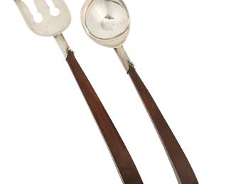 2212
Mid-20th century
A Mexican Sterling Silver And Rosewood Salad Set
Each marked: Sterling / A / Mexico; further marked: [Eagle 23]
Comprising a serving fork and spoon, 2 pieces
Each: 12.75" L approximately
Estimate: $200 - $300