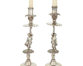 2048
19th century
A Pair Of Spanish Colonial Silver Figurative Candlesticks
Each appears unmarked
The silver candlesticks with domed bases and featuring mirrored figures coiled by a snake, 2 pieces
Each: 13.5" H x 4.5" Dia. approximately
59.1 oz. troy approximately
Estimate: $4,000 - $6,000