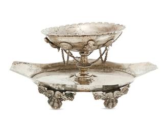 1141
19th century or earlier
A Spanish Colonial Silver Brazier
Appears unmarked
The dish footed with winged lion ball in claw feet below a raised scallop-rimmed bowl with applied masks and figures and chain swags
4.325" H x 8.75" W x 5.625" D
19.6 oz. troy approximately
Estimate: $400 - $600