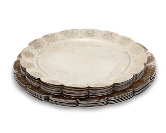 1051
Mid-20th century
A Set Of Mexican Silver Plates
Each marked to underside: 925 / Tobias A / Sterling
The plates with scalloped edges, each lobe featuring chased rose medallion motifs, comprising 8 salad plates (7.875" Dia.) and 8 dinner plates (8.875" Dia.), 16 pieces
125 oz. troy approximately
Estimate: $1,200 - $1,800