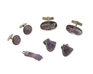 1338
A Group Of Mexican Silver And Amethyst Accessories
Mid-20th century
Two stamped: Silver / Mexico; one further stamped: AVS / 925; two unmarked
Four works comprising three pairs of silver cuff links, each with set carved or cabochon amethysts including fish and mask motifs (Largest: 1.125" H; Smallest: 0.625" H), as well as a silver and carved amethyst clenched hand motif charm (1.375" H), 7 pieces
44.3 grams gross
Estimate: $200 - $300
