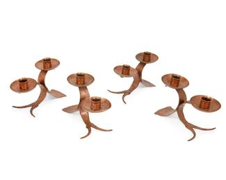 1043
Mid-20th century; Milwaukee, Wisconsin
Four Glander Ornamental Iron Works Copper Candelabra
Each stamped: G [within a circle and under a hand] / Hand Wrought
Each two-light hammered copper candelabrum with crimped bobèche, 4 pieces
Each: 5.5" H x 7.75" W x 4" D
Estimate: $300 - $500