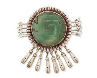 1167
A Mexican Silver Brooch With Carved Greenstone
Mid-20th century
Stamped: Silver / Mexico
A Fred Davis-style round brooch with central set carved greenstone and silver dangles
2.5" H x 2.5" W
27.9 grams gross
Estimate: $200 - $400