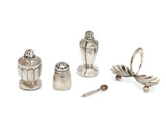 1321
Circa 1930s
A Group Of Silver Salt And Pepper Table Items
Each shaker marked: [Three owls] / Sanborns Mexico / Sterling; scoops marked: Sterling Taxco Silver Buinto [Eagle 3]
Comprising 25 Sanborns sterling silver salt and pepper shakers in various styles and sizes, 4 silver open salts with opposed clamshells, and 8 sterling silver salt scoops, 37 pieces
Open salts: 2.25" H x 2.875" W x 1.125" D; scoops: 1.5" L
Weighable sterling: 15.7 gross oz. troy approximately
Estimate: $200 - $400
