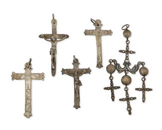 1118
A Group Of Silver Devotional Pendants
Late 18th century to early 20th century, Mexico
Each appears unmarked
Five works comprising two stamped and cast silver cross pendants, two stamped and cast silver crucifix pendants, and a large Yalalag ornate silver cross pendant with three cross-and-ball dangles, 5 pieces
Largest: 6" H x 2.5" W; Smallest: 3.25" H x 1.875" W
157.3 grams gross
Estimate: $500 - $700