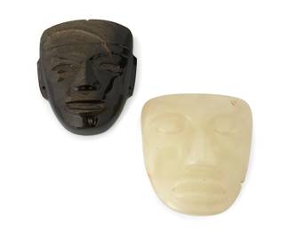 1168
Early 20th century
A Pair Of Carved Olmec-Style Stone Mask Ornaments
Each appears unmarked
Comprising two large carved stone mask faces, one mask in carved obsidian (5.5" H x 4.5" W x 1.5" D), and one mask in smooth pale green/off-white opaque stone (5.25" H x 4.75" W x 2" D), 2 pieces
Estimate: $600 - $800