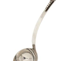 1206
Mid-20th century
A Mexican Sterling Silver Ladle
Marked: Hecho en Mexico D. F. / F. Ramirez / 0.925 / Sterling
The Jensen-style ladle with floral form handle accent
11" L
6.8 oz. troy approximately
Estimate: $200 - $300