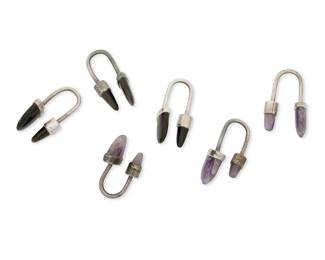 1332
A Group Of Mexican Silver And Hardstone Key Fobs
Mid-20th century
Variously marked: Silver / Sterling / 925 / Mexico / AEM [conjoined] / [Eagle 23]
Comprising six sterling silver double end key fobs, three with set amethyst ends and three with set obsidian ends, 6 pieces
Largest: 2" H; Smallest: 1.5" H
83.9 grams gross
Estimate: $300 - $500