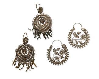 1147
Two Pairs Of Silver Filigree Earrings
Early/mid-20th century
Appear unmarked
Two works comprising a pair of silver-toned metal repoussé floral earrings (each 1.75" H x 1.5"W), and a pair of copper/brass-toned metal round wire filigree earrings with twisted flat metal dangles (each: 2.75" L x 1.5" W), 4 pieces
19.8 grams
Estimate: $400 - $600