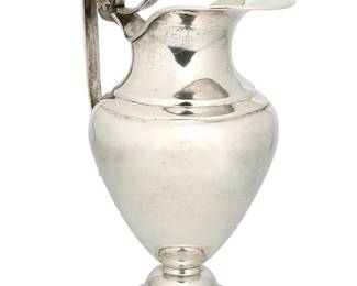 1139
Mid-19th century
A Spanish Colonial Silver Water Pitcher
Hallmarks for the Real Fábrica de Platería Martínez in Spain
The pitcher featuring a scrolled handle with applied flowers to upper juncture and applied female mask to the lower
11" H x 6.5" W x 5.5" D
31.8 oz. troy approximately
Estimate: $500 - $700