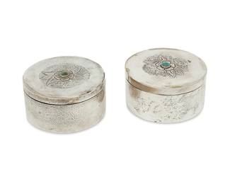 1229
Circa 1930s; Mexico City, Mexico
A Pair Of Sanborns Sterling Silver Lidded Boxes
Each marked: [Three owls] / Sanborns Mexico / Sterling
The round lidded boxes with inset turquoise centering a chased flower, 2 pieces
Each: 1.75" H x 3.325" Dia.
12.4 gross oz. troy approximately
Estimate: $200 - $400