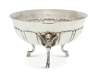 1129
Mid-20th century; Mexico City, Mexico
A Sanborns Sterling Silver Footed Bowl
Stamped to underside: [Three owls] / Sanborns Mexico / sterling / Made in Mexico
The bowl with repoussé lobed design and raised on three molded silver feet with winged lion mask and paw feet
4.125" H x 6.75" Dia.
16.6 oz. troy approximately
Estimate: $200 - $400