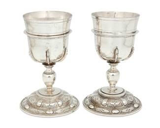 1127
Circa 1930s
Two Mexican Spanish Colonial-Style Sterling Silver Goblets
Each marked: Sterling / Mexico / 925
The goblets mounted to base with incised and repoussé geometric motifs, 2 pieces
Each: 7.125" H x 4.325" Dia.
30.8 oz. troy approximately
Estimate: $500 - $700