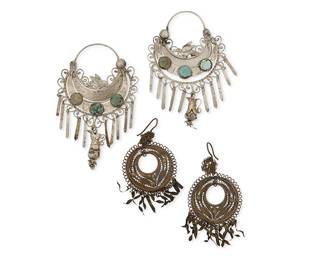 1146
Two Pairs Of Silver And Mixed Metal Filigree Earrings
Early 20th century
Each appears unmarked
Two works comprising a pair of silver-toned metal "las media lunas" or half-moon earrings with applied birds, set turquoise and multiple dangles including a pitcher (each: 3.25" H x 2.125" W), as well as a pair of copper/brass-toned metal round wire filigree earrings with twisted flat metal dangles (each: 2.5" H x 1.375" W), 4 pieces
38.3 grams gross
Estimate: $500 - $700
