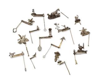 1120
18th/19th century, Mexico
A Collection Of Mexican Silver Metal Matracas Noisemakers
Each appears unmarked
Comprising fourteen works, most in silver-toned metal and vermeil, with fabric flowers and clusters of foil strip elements, all with slender or decorative handles and rotating ratchet elements, and depicting various animals and figures including dogs, birds, a peacock, horses, and a dancer, as well as decorative urns, and delicate pictorial scenes including hunting, battle, and multiple equestrian activities, 14 pieces
Largest: 5" H x 2" W x 1.75" D; Smallest: 2.25" H x 1.5" W x 0.5" D
Estimate: $1,500 - $2,500