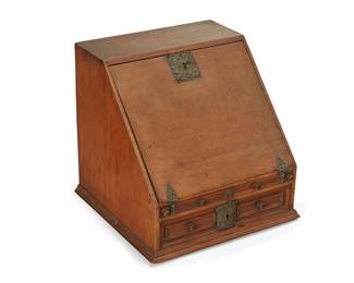 1182
Late 19th/early 20th century
A Petit Spanish Colonial-Style Vargueño
Appears unmarked
The wood desk with chased and repoussé scrolled metal escutcheons, featuring a locking drop front lined in red damask fabric supported on pull-out arms, revealing thirteen drawers, one with columnar architectural front, above two long drawers, one with locking mechanism
17.25" H x 17.75" W x 17.25" D
Estimate: $600 - $800