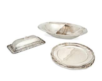 1323
Circa 1930s/40s; Mexico City, Mexico
A Group Of Sanborns Sterling Silver Table Items
Each marked for Sanborn and for sterling
Comprising a lidded butter dish, a divided vegetable serving dish, and four salad plates, 6 pieces
Dish: 2.25" H x 13" W x 8.75" D; plates: 8" Dia.; butter: 2" H x 8" W x 4" D
69.6 oz. troy approximately
Estimate: $300 - $500