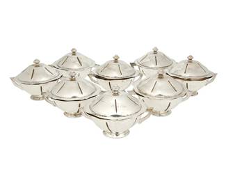 1204
Circa 1930s; Mexico City, Mexico
A Set Of Sanborns Sterling Silver Soup Bowls
Each marked: [Three owls] / Sanborns Mexico / Sterling
Comprising eight footed and lidded soup bowls with hammered interiors, incised linear design, and opposed handles, 8 pieces
Each: 4" H x 6" W x 4.625" D
63.7 oz. troy approximately
Estimate: $1,000 - $1,500