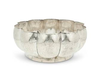 1050
Mid-20th century; Mexico City, Mexico
A Sanborns Sterling Silver Punch Bowl
Stamped to underside: [Three owls] / Sanborns Mexico / Sterling
The hammered sterling footed punch bowl with scalloped edges
6.25" H x 15" Dia.
72.4 oz. troy approximately
Estimate: $1,000 - $1,500