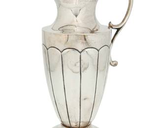 1094
Circa 1930s/40s; Mexico City, Mexico
A Sanborns Sterling Silver Ewer
Marked to underside: [Three owls] / Sanborns Mexico / Sterling
The footed water pitcher with lobed waist, scrolled handle, and interior ice catcher
12.325" H x 7.25" W x 5" D
39.44 oz. troy approximately
Estimate: $600 - $800