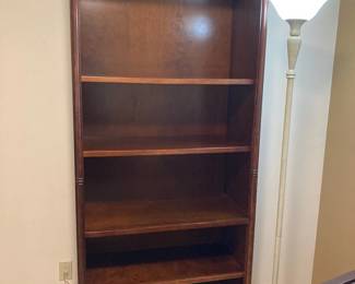 Wooden bookshelf and lamp