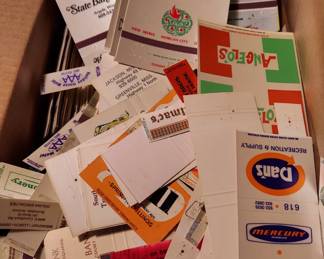 Assorted match covers and books