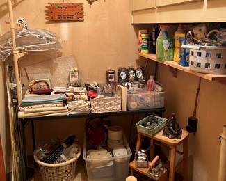 Miscellaneous laundry & cleaning supplies, table linens, Tupperware, wood stool, 