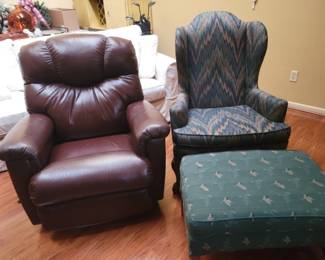 Brown leather recliner, green wingback chair