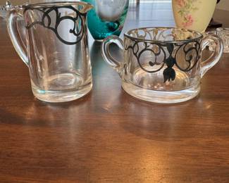Creamer and sugar with art nouveau silver overlay