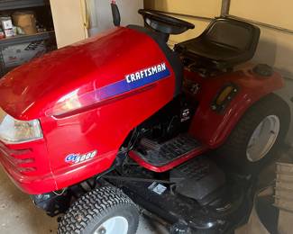 Craftsman riding mower in excellent condition. Leaf sweeper attachment included.