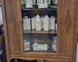 China Cabinet filled with Vintage Canisters
