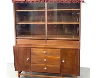 Lot 307 Stanley Mid Century Modern Display China Cabinet. Glass sliding doors. 