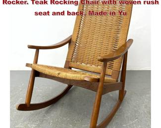 Lot 284 Vintage Hans Wegner style Woven Rocker. Teak Rocking Chair with woven rush seat and back. Made in Yu