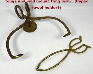 Lot 342 2 pc brass Objects. Oversized ice tongs and wall mount Tong form . Paper towel holder