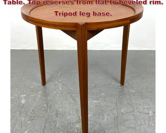 Lot 123 Danish Modern Teak Round Side Table. Top reverses from flat to beveled rim. Tripod leg base.
