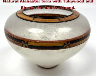 Lot 43 Alabaster vase by Guy Michaels. Natural Alabaster form with Tulipwood and Ebony trim bands. Signed.