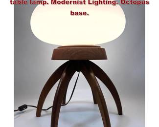 Lot 136 Frosted glass and walnut Octopus table lamp. Modernist Lighting. Octopus base. 